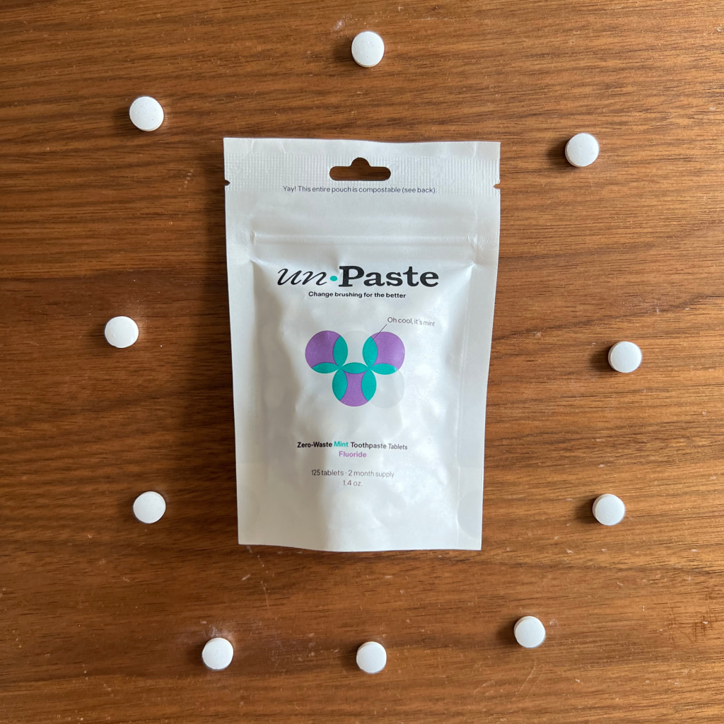 Unpaste toothpaste tablet in a compostable pouch