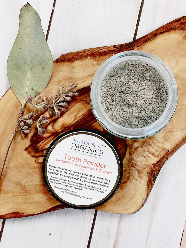 Butter Me Up Organics toothpowder in a glass jar